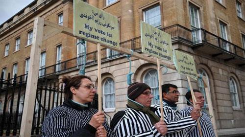 Iranian opposition protesters stand through