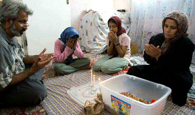 poverty in Iran family sit on floor while eating